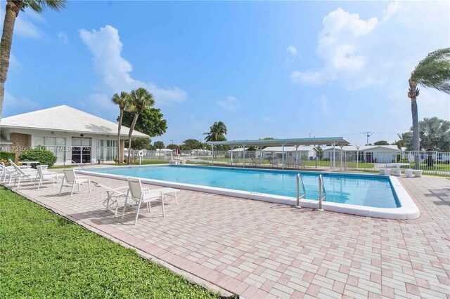 2751 E Golf Blvd Unit 2029, Pompano Beach, FL 33064 - community pool featuring fence and a patio area