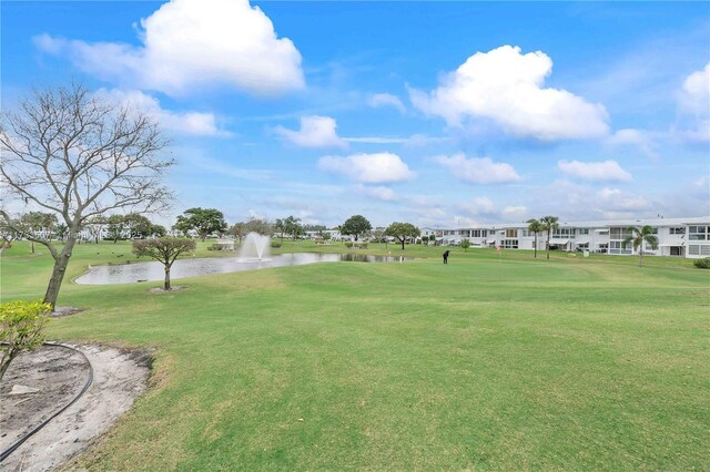2751 E Golf Blvd Unit 2029, Pompano Beach, FL 33064 - view of property's community featuring a water view, a lawn, and view of golf course