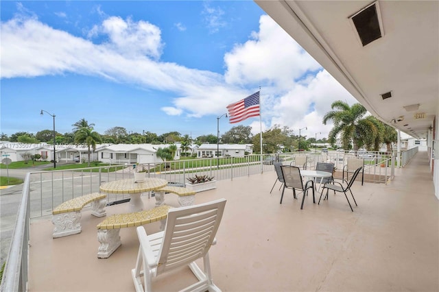 2751 E Golf Blvd Unit 2029, Pompano Beach, FL 33064 - view of patio featuring outdoor dining space and a residential view