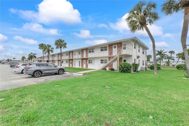 2751 E Golf Blvd Unit 2029, Pompano Beach, FL 33064 - view of property featuring uncovered parking and stairway