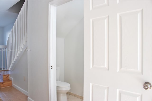 bathroom with tile patterned floors and toilet