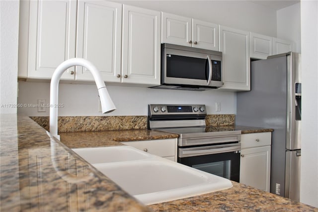 153 SE 28th Pl Unit 3, Homestead, FL 33033 - kitchen with stainless steel appliances and white cabinets