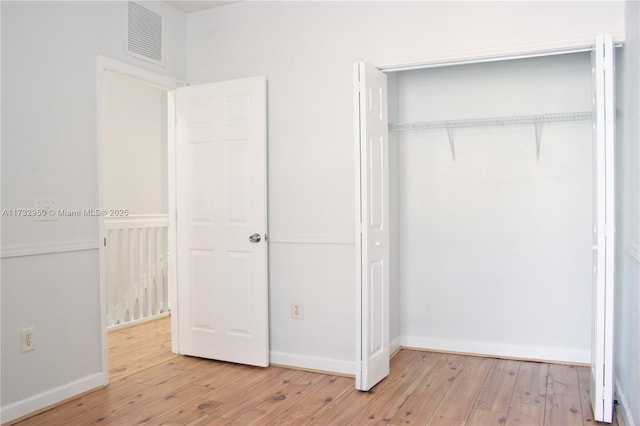 153 SE 28th Pl Unit 3, Homestead, FL 33033 - unfurnished bedroom featuring light wood-type flooring and a closet