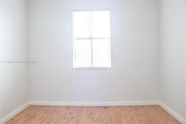 unfurnished room featuring light wood-type flooring