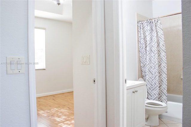 full bathroom with vanity, tile patterned flooring, shower / bath combination with curtain, and toilet