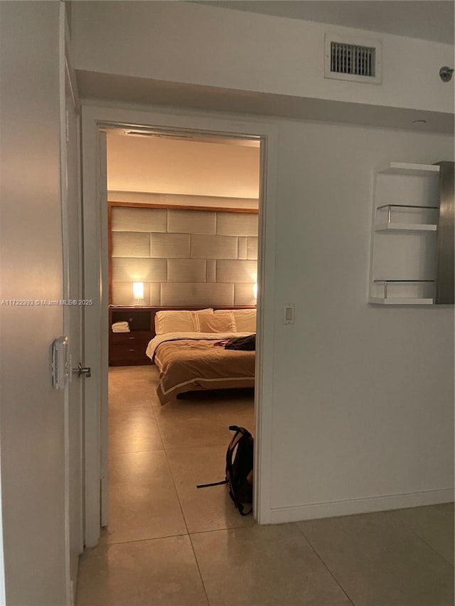 unfurnished bedroom featuring visible vents and baseboards