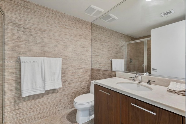 50 Biscayne Blvd Unit 601, Miami, FL 33132 - full bath featuring a stall shower, tile patterned flooring, toilet, and vanity