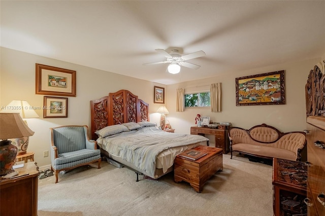 bedroom featuring ceiling fan and light carpet