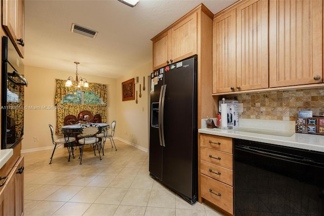 kitchen featuring decorative light fixtures, decorative backsplash, light tile patterned floors, a notable chandelier, and black refrigerator with ice dispenser