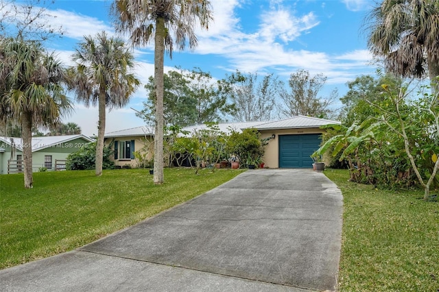 ranch-style home with a garage and a front lawn