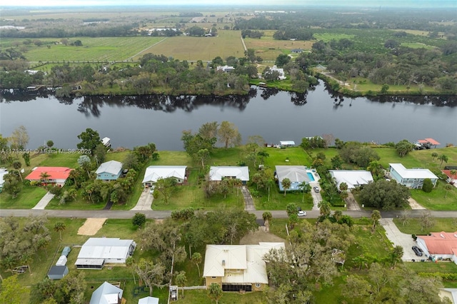 drone / aerial view featuring a water view and a rural view