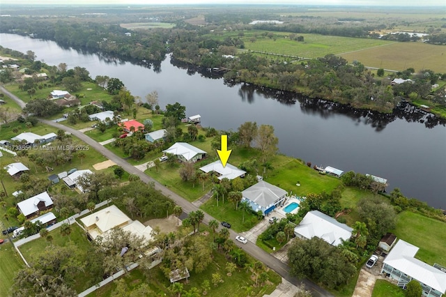 birds eye view of property with a water view