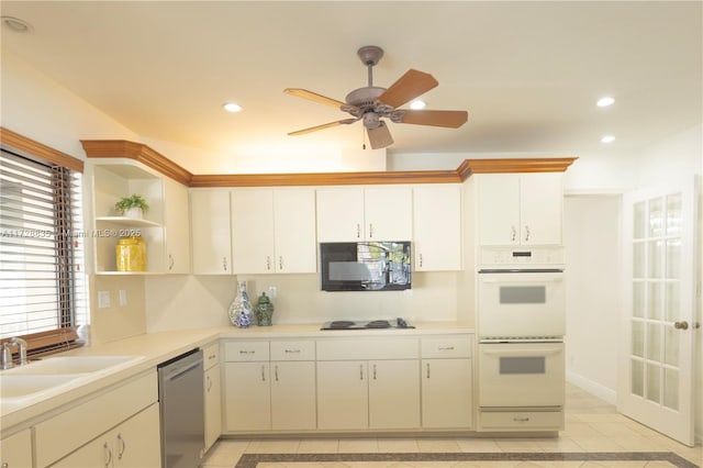 kitchen with sink, white double oven, dishwasher, ceiling fan, and gas stovetop