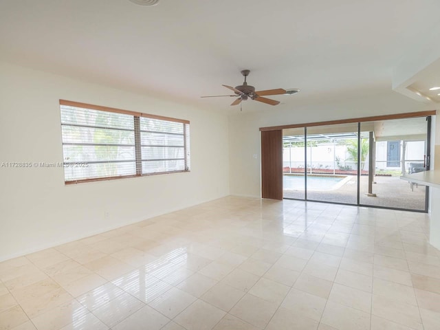 spare room with ceiling fan