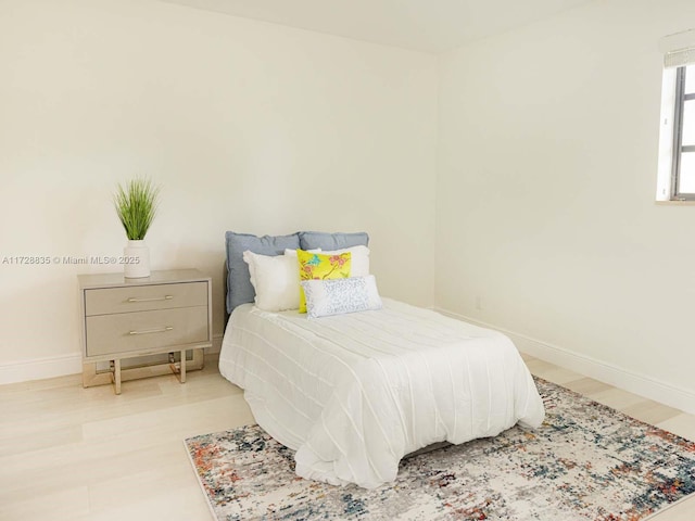 bedroom with wood-type flooring