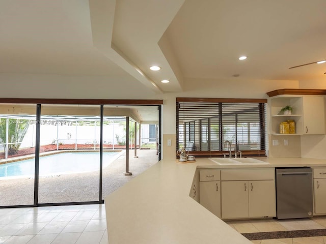 kitchen with white cabinetry, stainless steel dishwasher, a healthy amount of sunlight, and sink