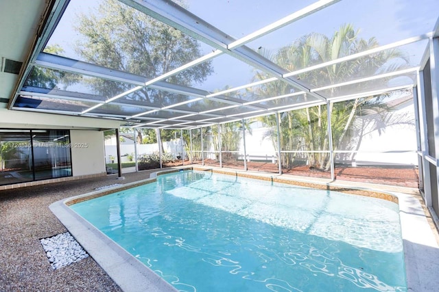 view of swimming pool with a lanai