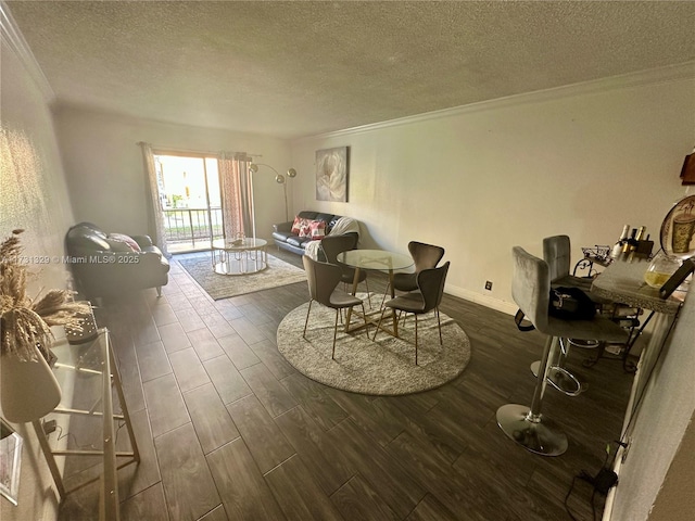 dining space featuring crown molding and a textured ceiling