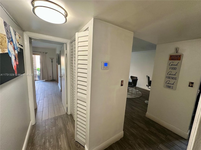 corridor featuring dark hardwood / wood-style floors