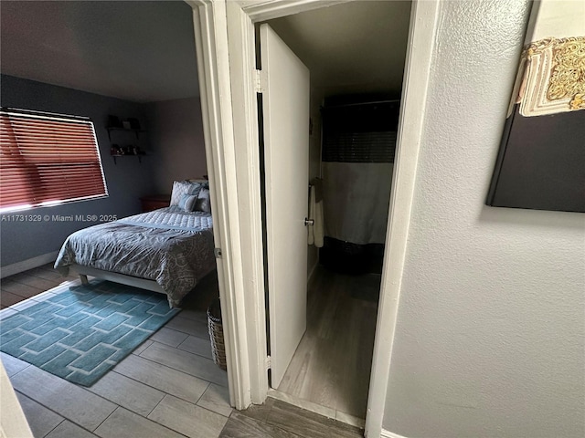 bedroom featuring hardwood / wood-style flooring