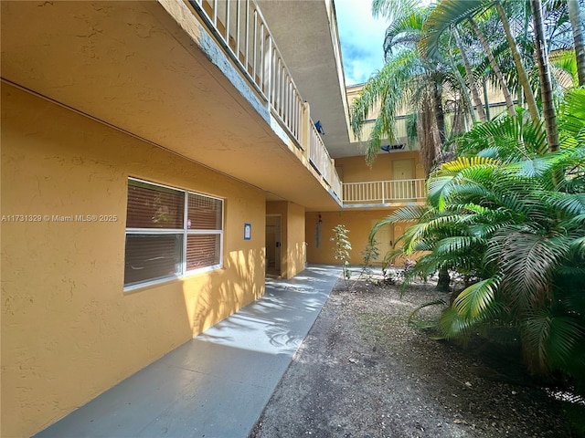 view of side of property featuring a patio