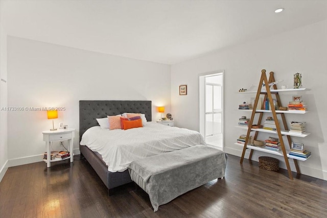 bedroom featuring dark hardwood / wood-style flooring