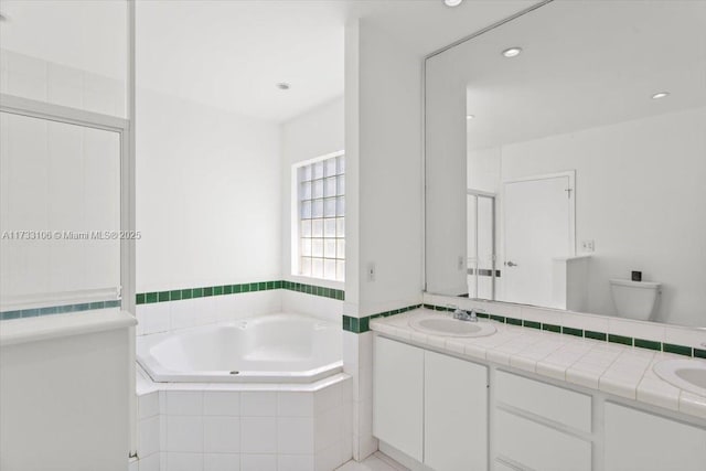 full bathroom with vanity, toilet, and shower with separate bathtub