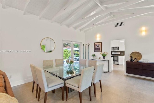 dining room with beamed ceiling, high vaulted ceiling, and french doors