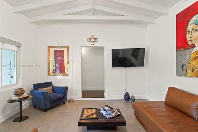 living room with vaulted ceiling with beams