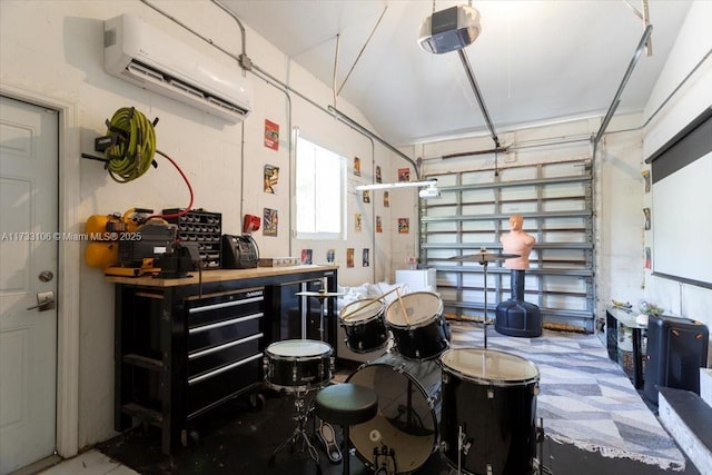 garage with a garage door opener, an AC wall unit, and a workshop area