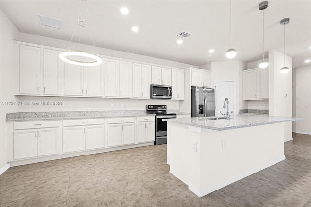 kitchen with white cabinetry, stainless steel appliances, a kitchen island with sink, and pendant lighting