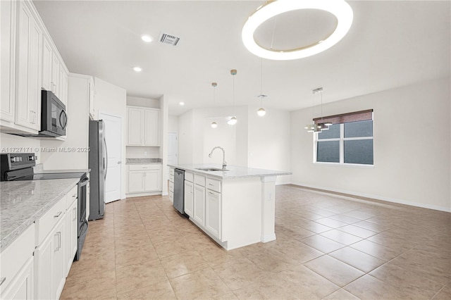 kitchen with stainless steel appliances, white cabinetry, and decorative light fixtures