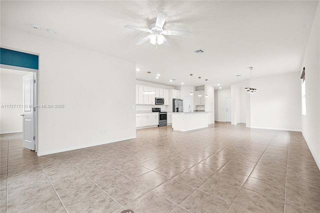 unfurnished living room featuring ceiling fan and light tile patterned flooring