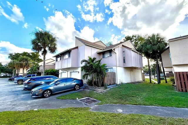 view of home's exterior with a lawn