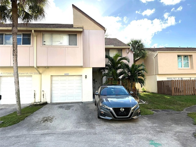 townhome / multi-family property featuring a garage