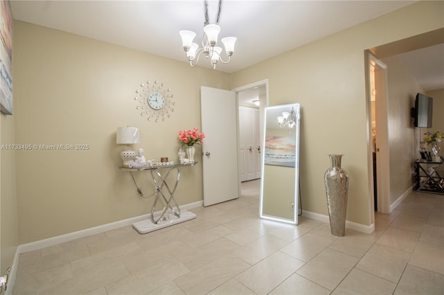 interior space with light tile patterned floors and a chandelier