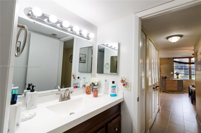 bathroom with vanity and tile patterned flooring