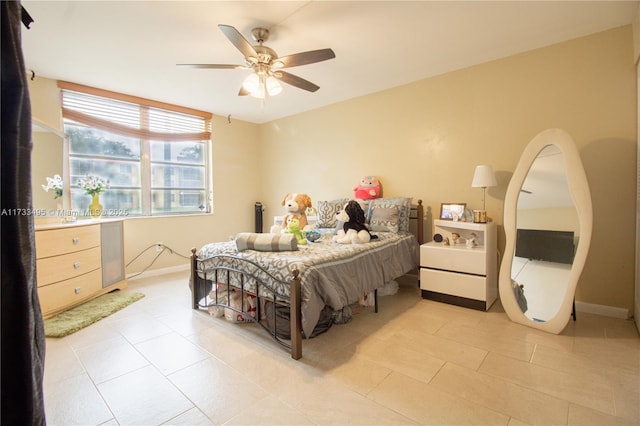 bedroom featuring light tile patterned floors and ceiling fan