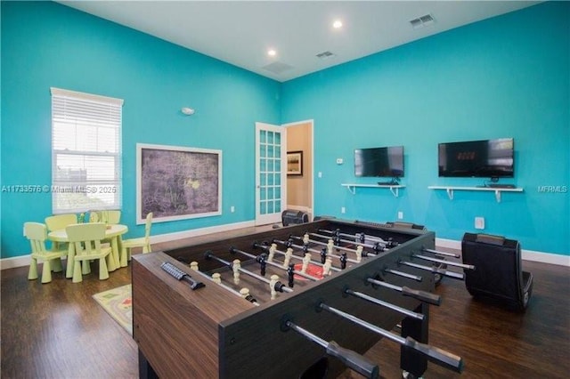 playroom featuring dark wood-type flooring