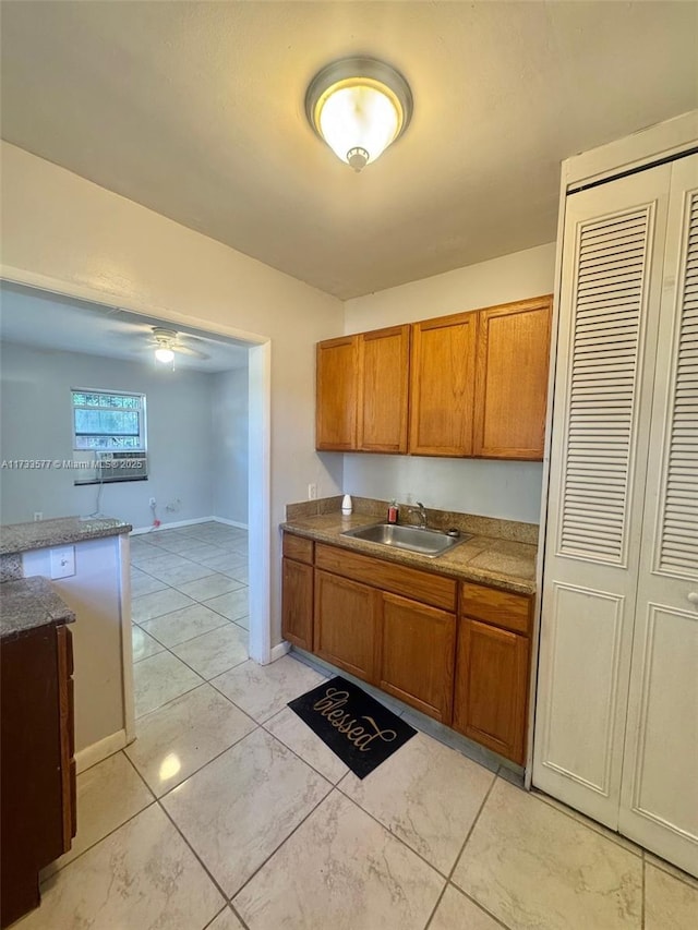 kitchen featuring sink and ceiling fan