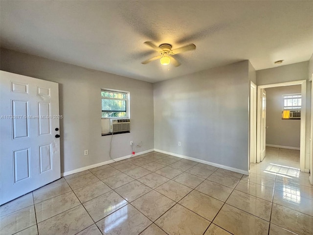 entryway featuring cooling unit, a textured ceiling, a wealth of natural light, and ceiling fan