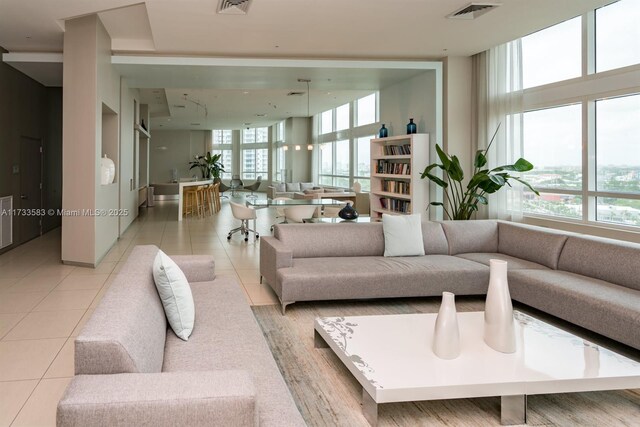 tiled living room with plenty of natural light