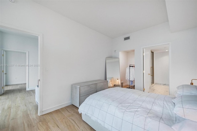 bedroom with light wood-type flooring