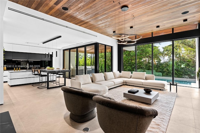 tiled living room with a notable chandelier and wood ceiling