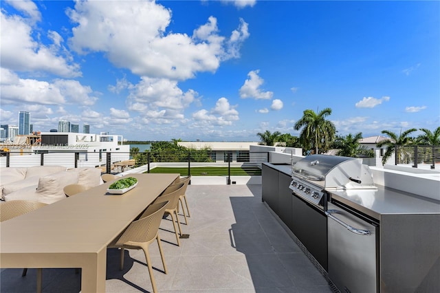 view of patio featuring a grill, exterior bar, and area for grilling