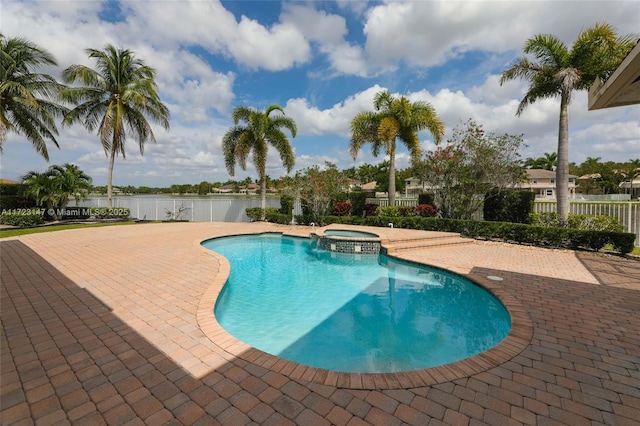 view of pool with a patio and an in ground hot tub