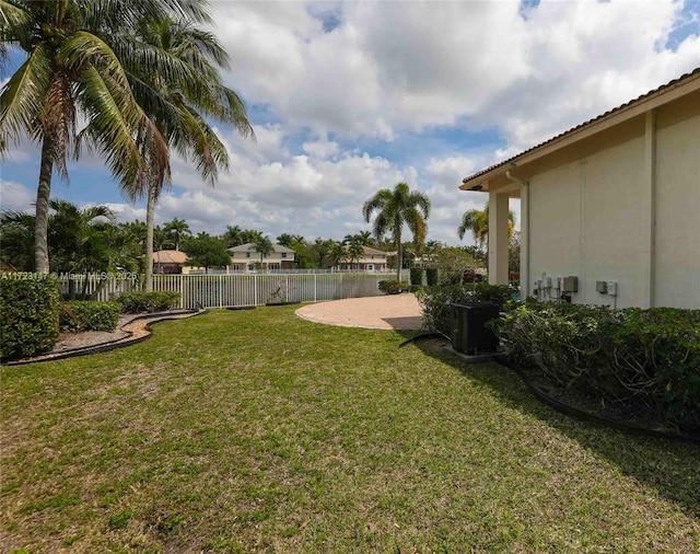 view of yard featuring cooling unit and a patio area