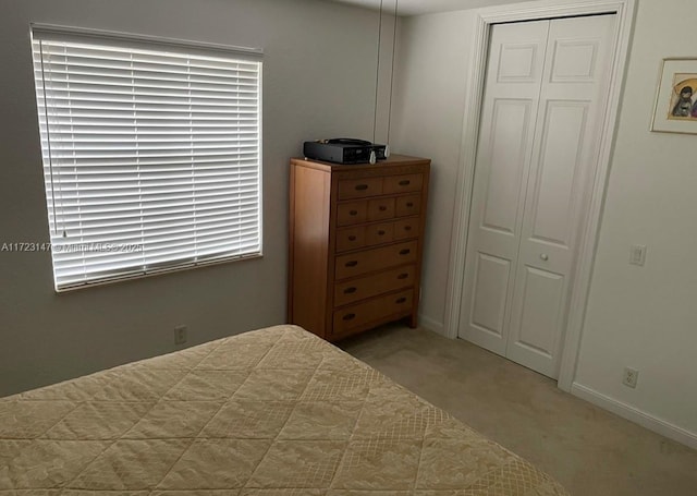 carpeted bedroom with a closet