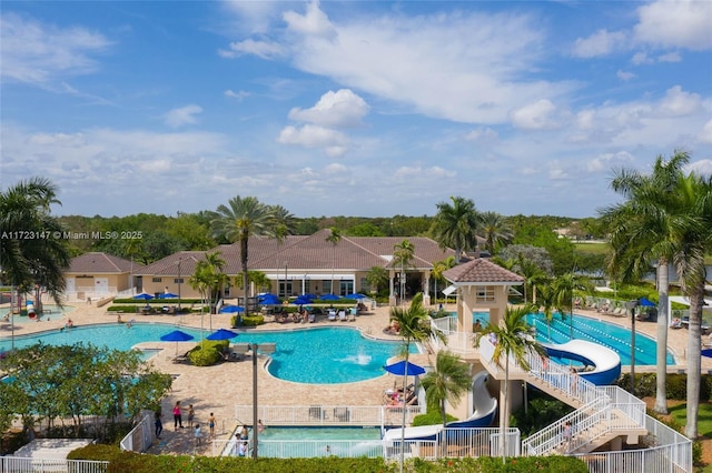 view of pool featuring a patio and a water slide