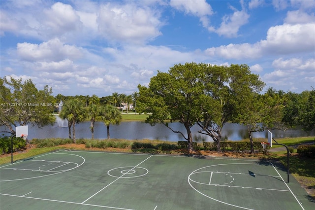 view of sport court with a water view